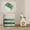 Laste mänguasjade hoiuriiul 6 kangast sahtliga ja raamaturiiuliga | E-pood Tootemaailm Laste hoiuriiul kuue rohelise kangast kastiga, mõõdud 71 x 63 x 30 cm, külje peal lõvikujundus