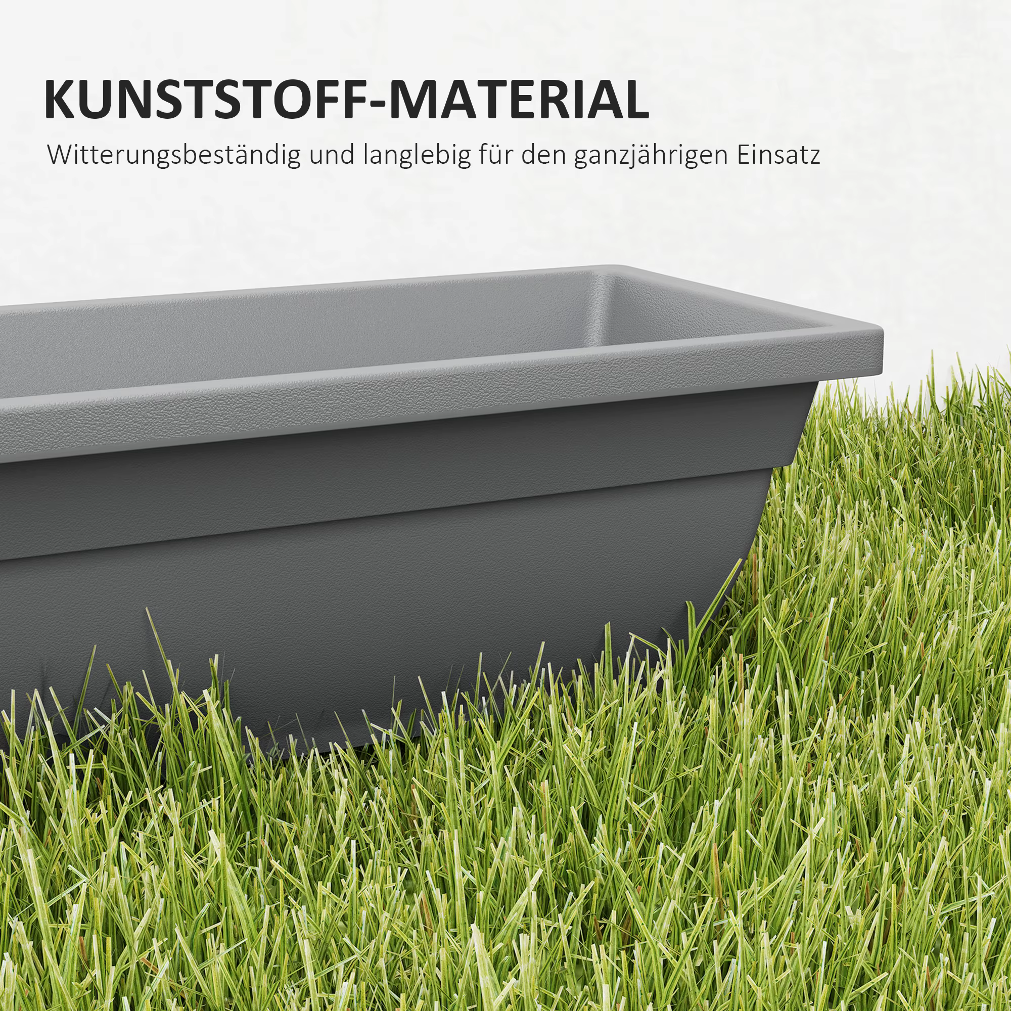 Hall plastikist lillekast murul, peal tekst „KUNSTSTOFF-MATERIAL”