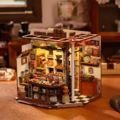 Kokkupandud miniatuurne šokolaadipood detailse sisustuse ja ruudulise põrandaga