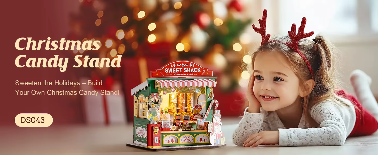 Jõulukommiputka Sweet Shack mudel lapse ja jõulukaunistustega taustal
