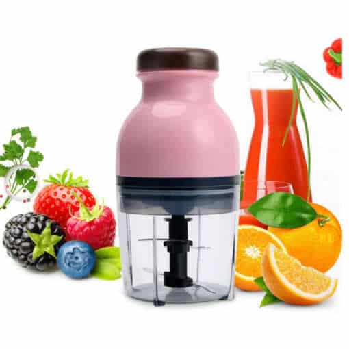 väike roosa blender läbipaistva anumaga, ümbritsetud puuviljadega