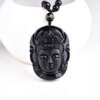 mustast kivist Buddha peaga kaelakee valgel taustal