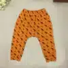 oranžid puuvillast beebipüksid mustade loomadega