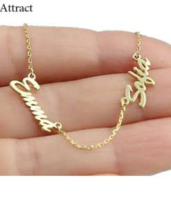 Gold-colored personalized necklace with names 'Emma' and 'Sofia' held in a hand, displaying fine chain and delicate nameplate design.