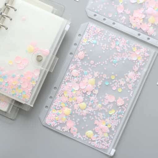 Roosa sädelev lukuga kott lehtede hoidmiseks koos spiraaliga, sobib Filofax ja Dokibook märkmikule.