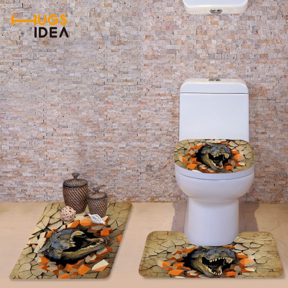 WC-komplekt dinosaurustega, mis sisaldab pehmet tualetipoti katet, tualetikaane katet ja vannitoa vaipa dinosauruse teemalises disainis.