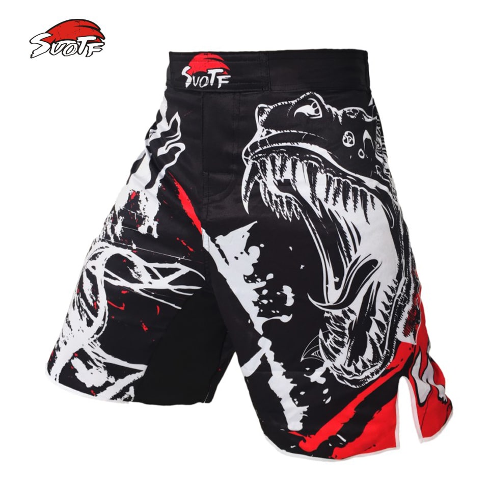 Dinosaurusega mustad hingavad MMA püksid, millel on domineeriv disain.