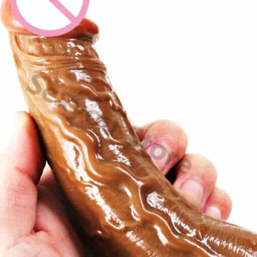 Täispumbatav iminapaga dildo halli taustaga, esiküljelt vaadatuna