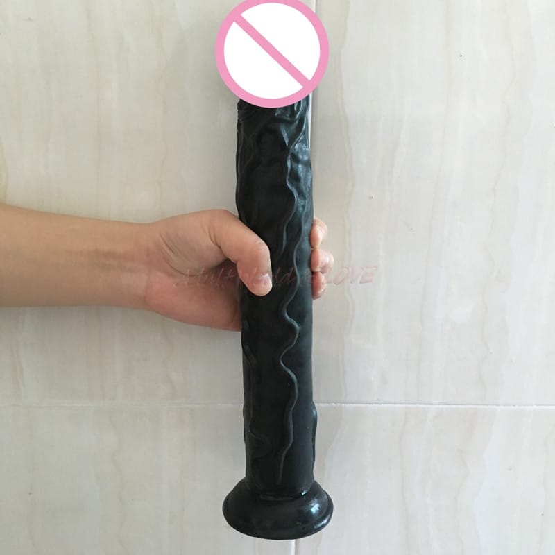 Suur iminapaga dildo, musta värvi, realistlik disain, kinnitub kindlalt siledale pinnale.