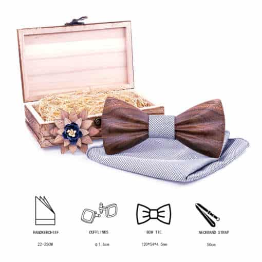 Komplekt, mis sisaldab elegantset lipsu, sobivat rätikut ja stiilset prossi.