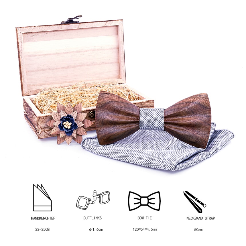 Komplekt, mis sisaldab elegantset lipsu, sobivat rätikut ja stiilset prossi.