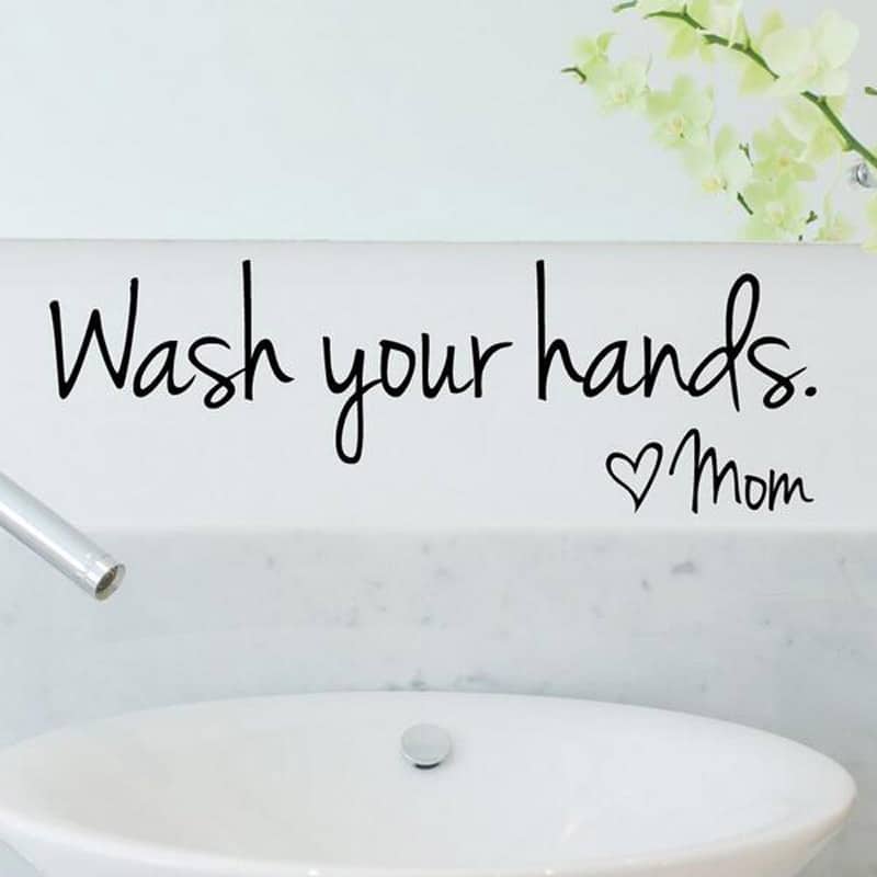 seinakleeps tekstiga wash your hands valgel taustal