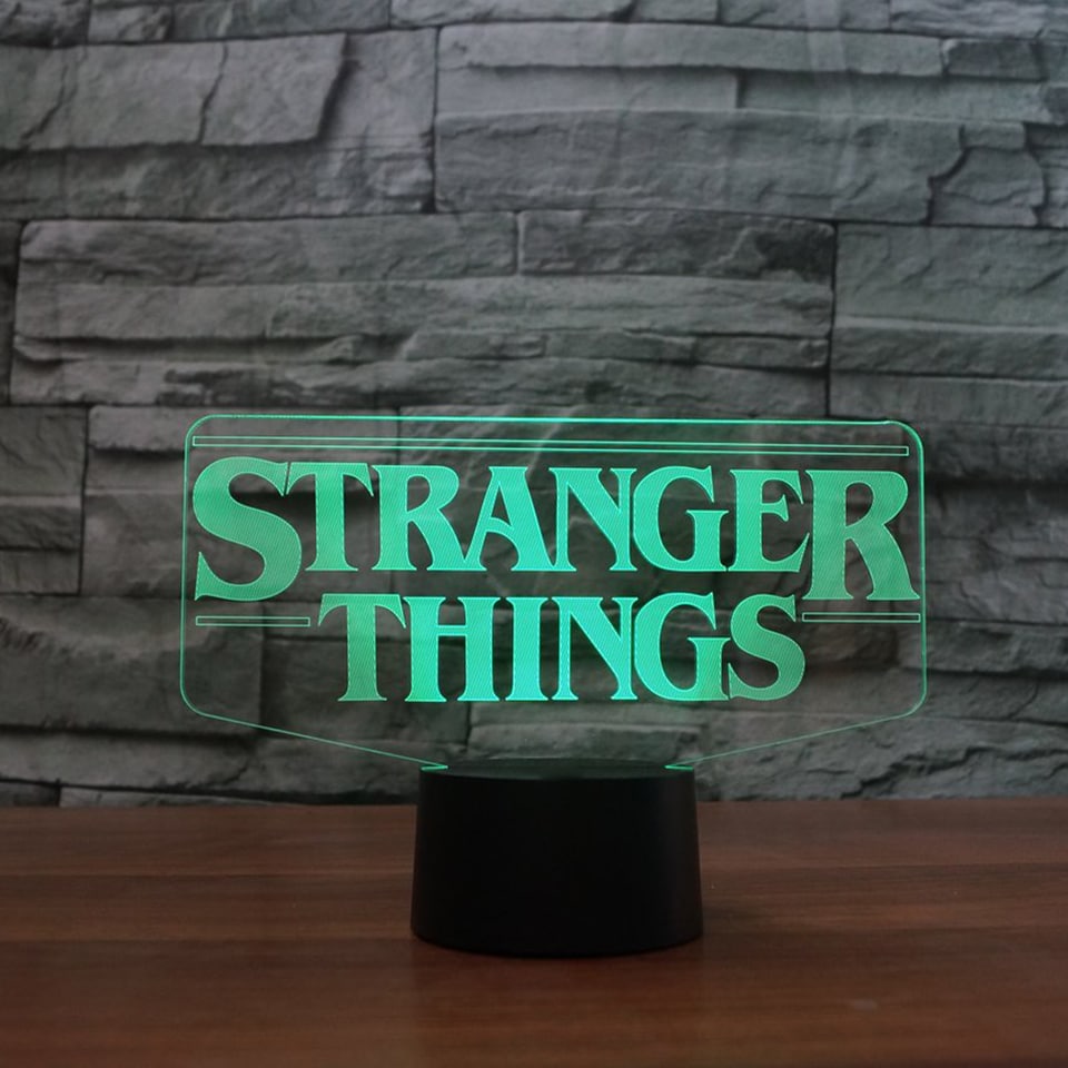 LED lamp stranger things teemalise kujundusega musta alusega ja värviliste tuledega