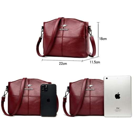 punane naiste õlakott mõõtudega 22x18x11.5 cm, kõrval nutitelefon ja tahvelarvuti