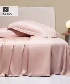 roosa siidist voodipesu komplekt voodil