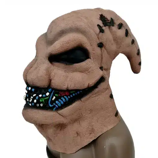 pruun lateksist mask, millel on mustad silmad ja suu, kaunistatud värviliste detailidega