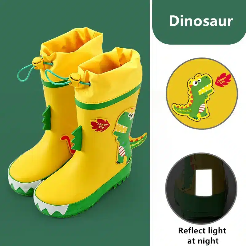 kollased laste kummikud roheliste detailidega ja dinosauruse pildiga