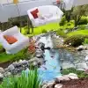 3D põrandakleeps, mis kujutab voolavat oja kivide ja kaladega