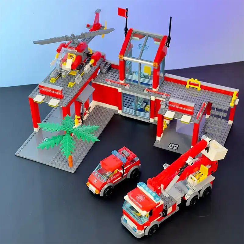 lego tuletõrjedepoo koos helikopteri ja kahe päästeautoga